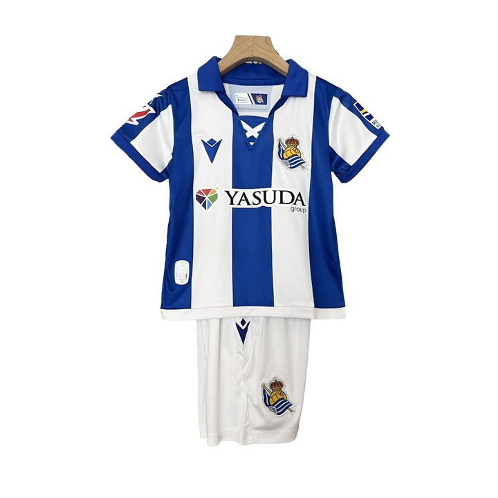Camisa infantil do Real Sociedad I 24/25. Estilo e qualidade para os fãs do clube. Compre agora!