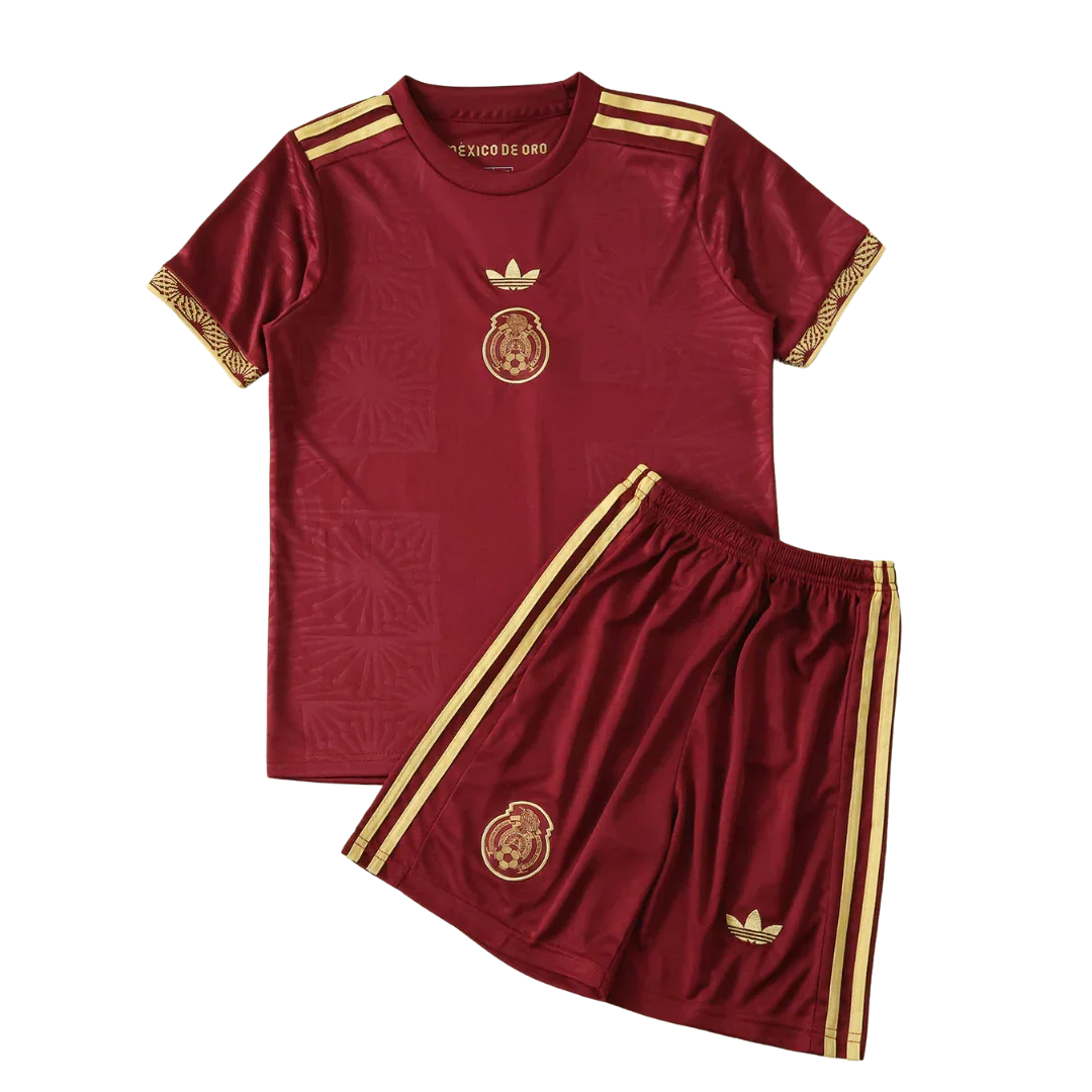 Kit infantil México Conceito 25/26 vinho e dourado. Camisa e shorts com escudo do México, logos Adidas trefoil e listras.
