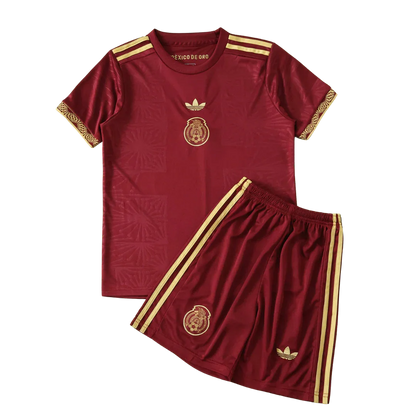 Kit infantil México Conceito 25/26 vinho e dourado. Camisa e shorts com escudo do México, logos Adidas trefoil e listras.