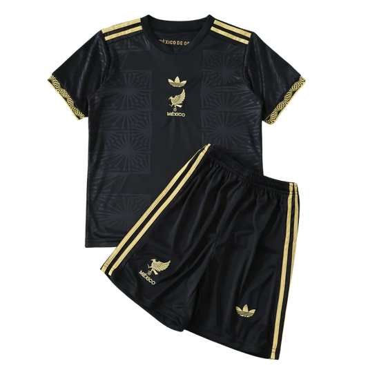 Kit infantil Mexico preto e dourado com camisa e shorts. Inclui emblemas do México e logo Adidas em dourado.