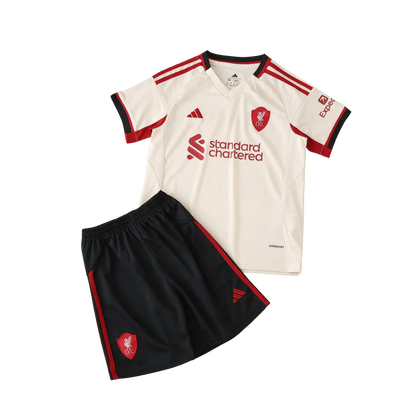 Kit infantil oficial Liverpool FC: camisa e shorts Mini Mantos. Modelo creme e preto