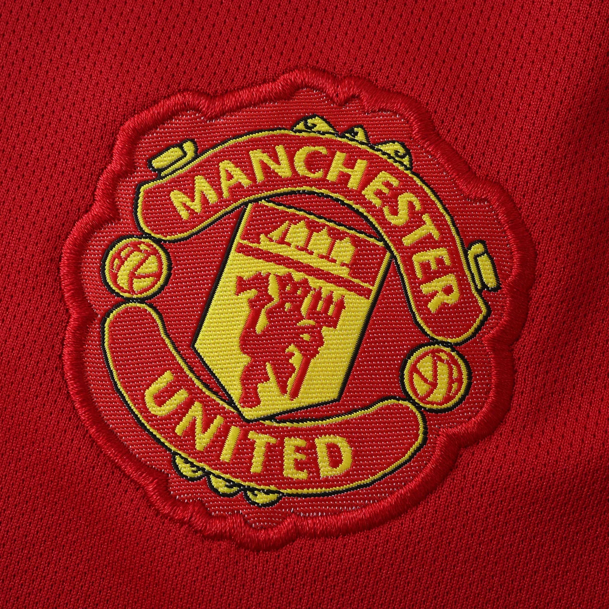 Camisa oficial infantil Manchester United, perfeita para o kit Mini Mantos. Logo bordado de alta qualidade