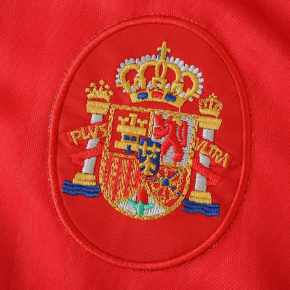 Camisa Espanha infantil oficial kit bordado Mini Mantos com brasão detalhado em tecido vermelho