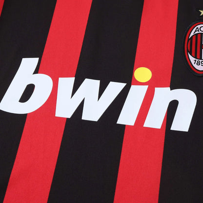 Camisa oficial Mini Mantos AC Milan infantil, kit com listras rubro-negras e logo bwin em destaque